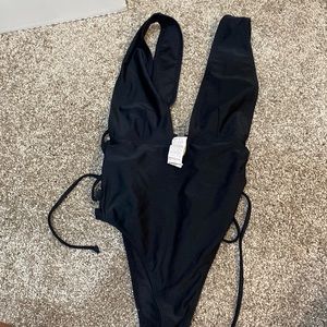 WORN ONCE. ONE PIECE SWIMSUIT